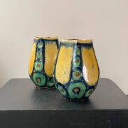 A pair of green and yellow vases
