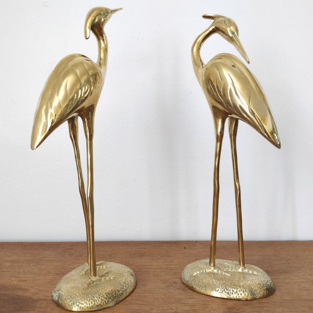 Couple large herons in polished golden brass
