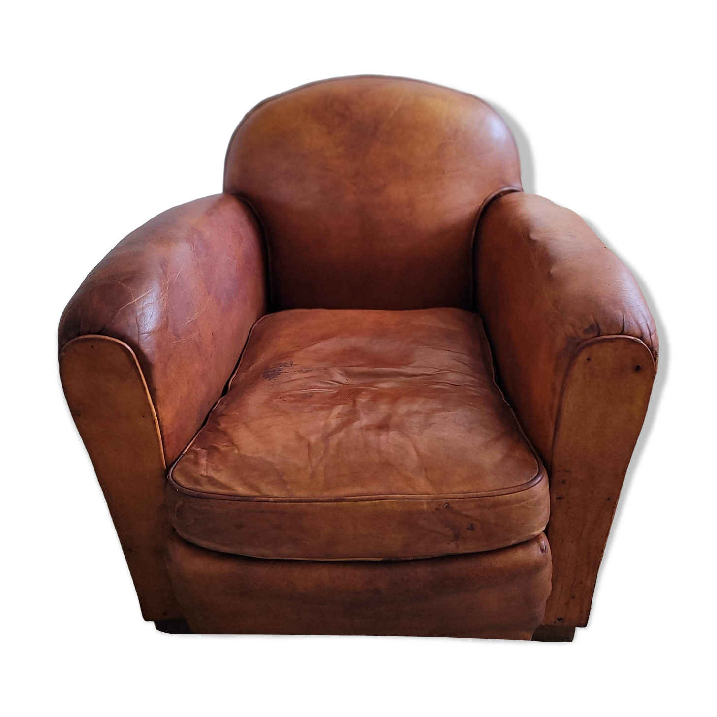 Fauteuil club en cuir patiné