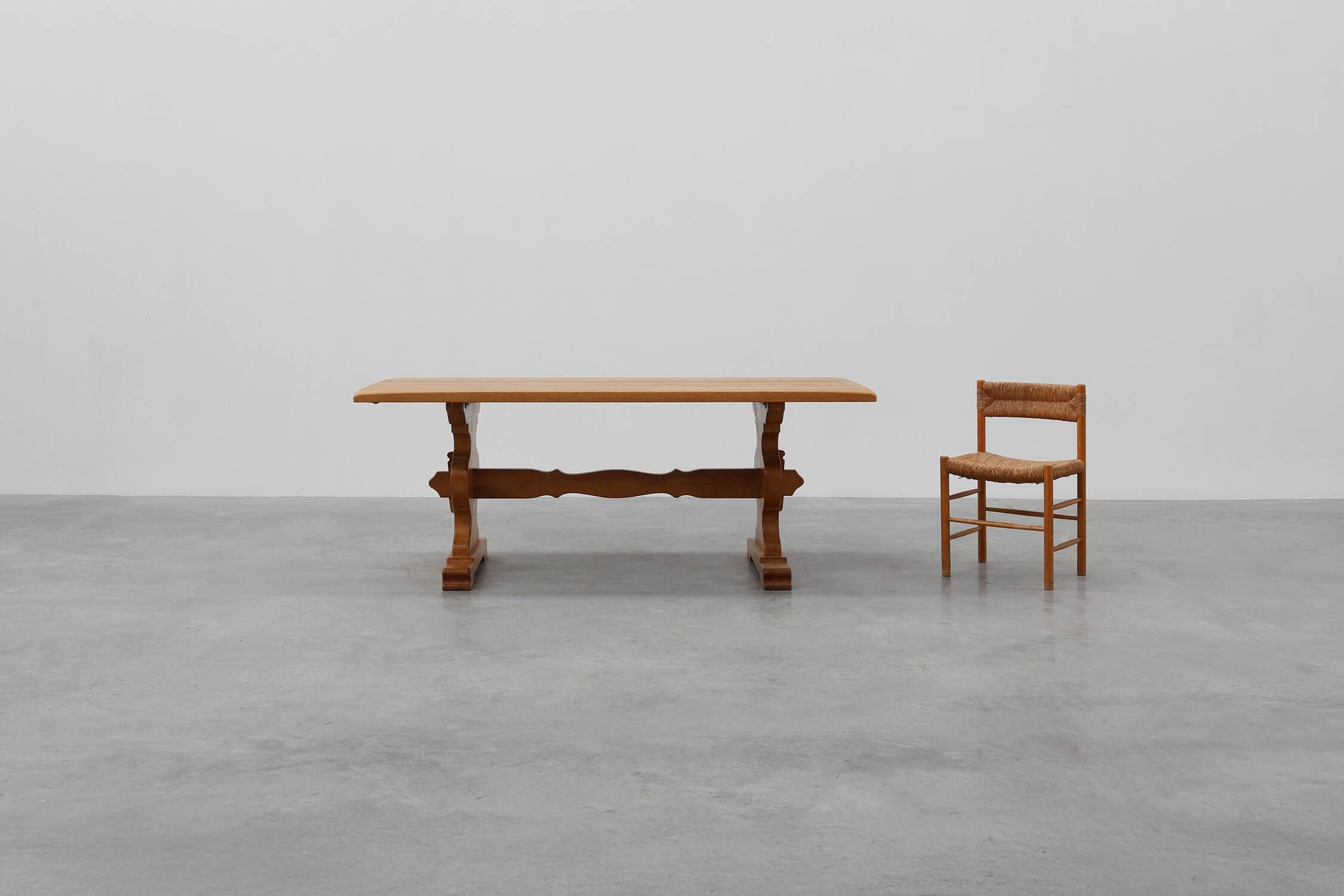 20th Century French oak trestle table with scalloped legs and plank top