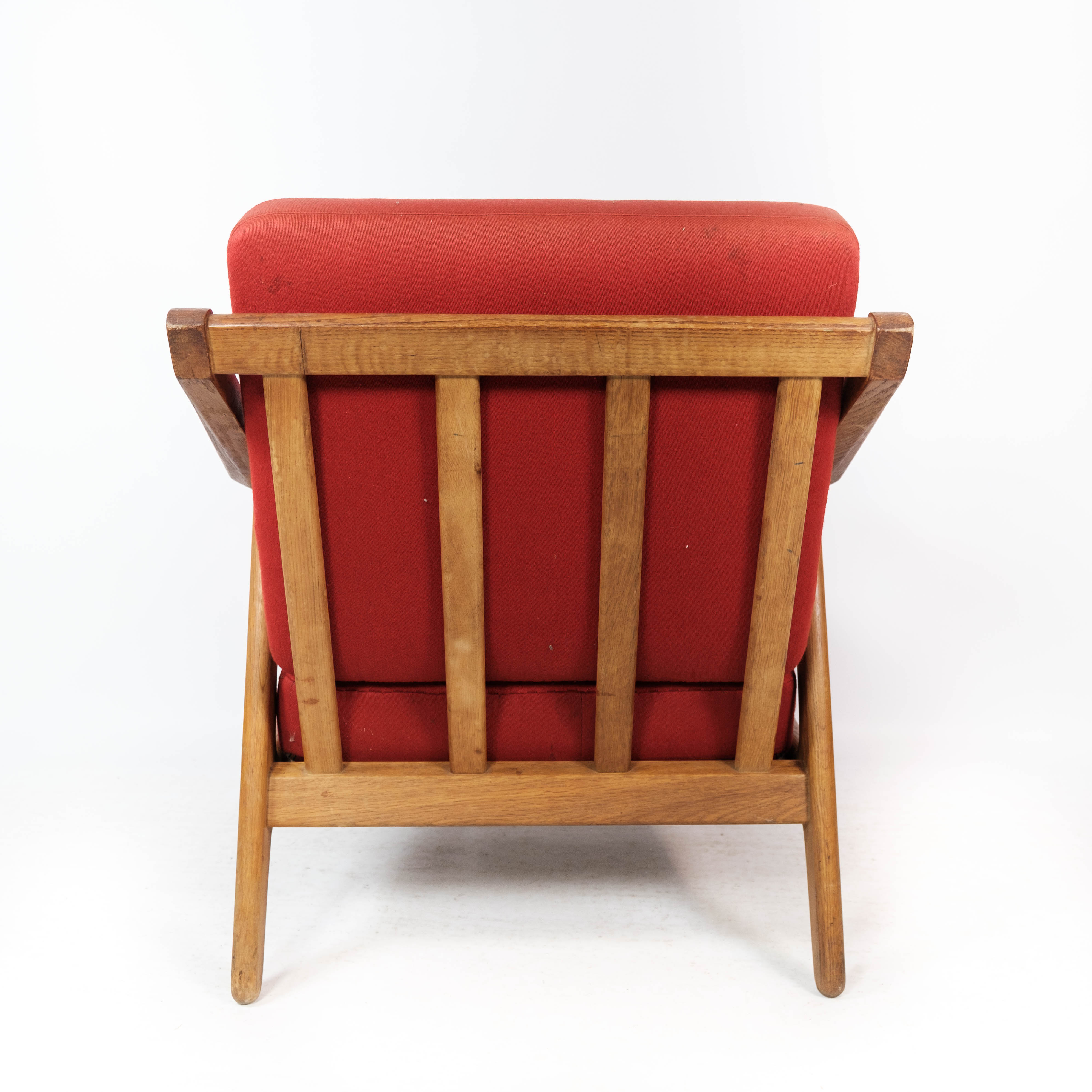 Armchair in oak and upholstered with red fabric, designed by H. Brockmann Pedersen, 1960s