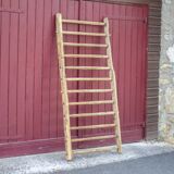 Old vintage wooden animal barrier, wall espalier, plant holder