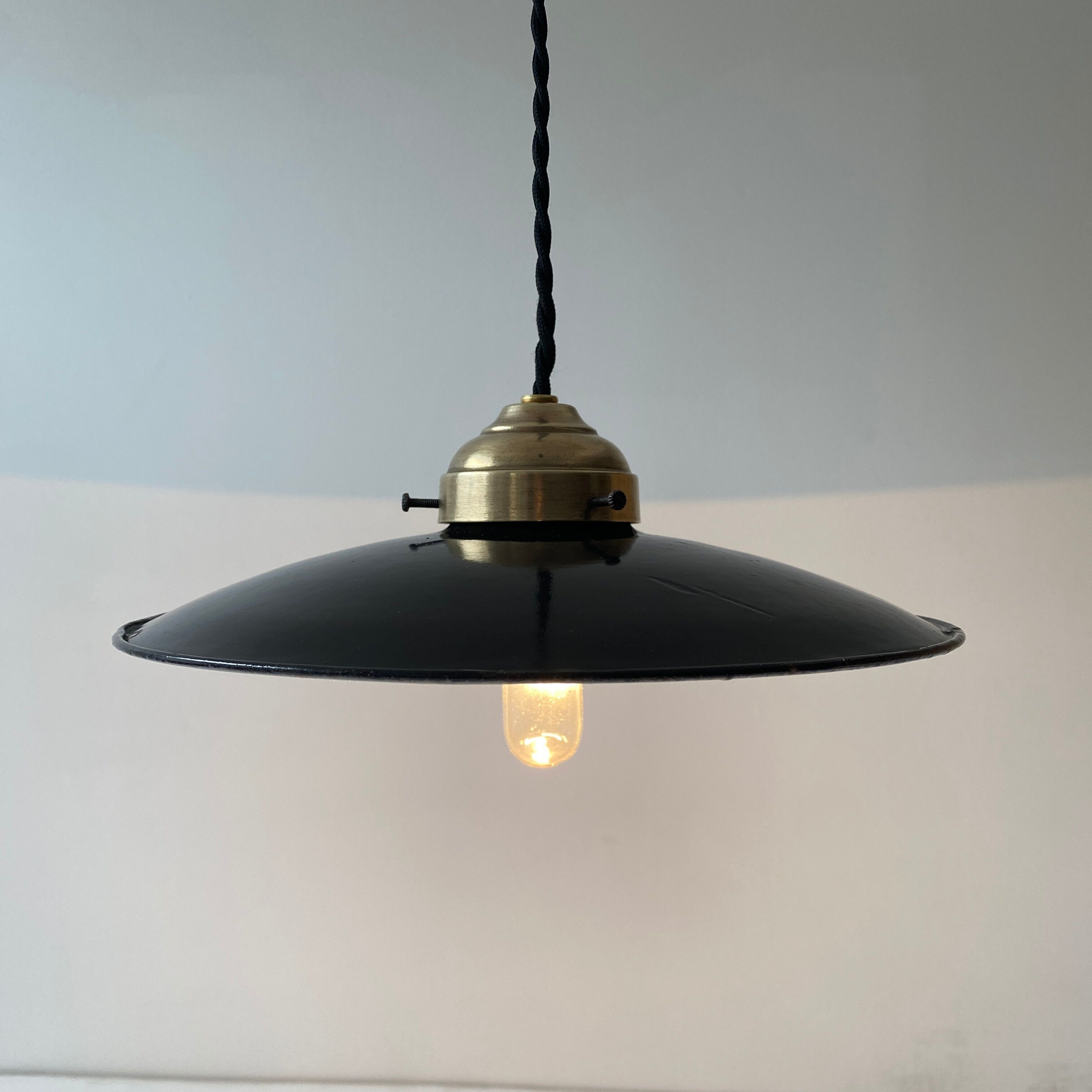 Old black enamelled industrial suspension