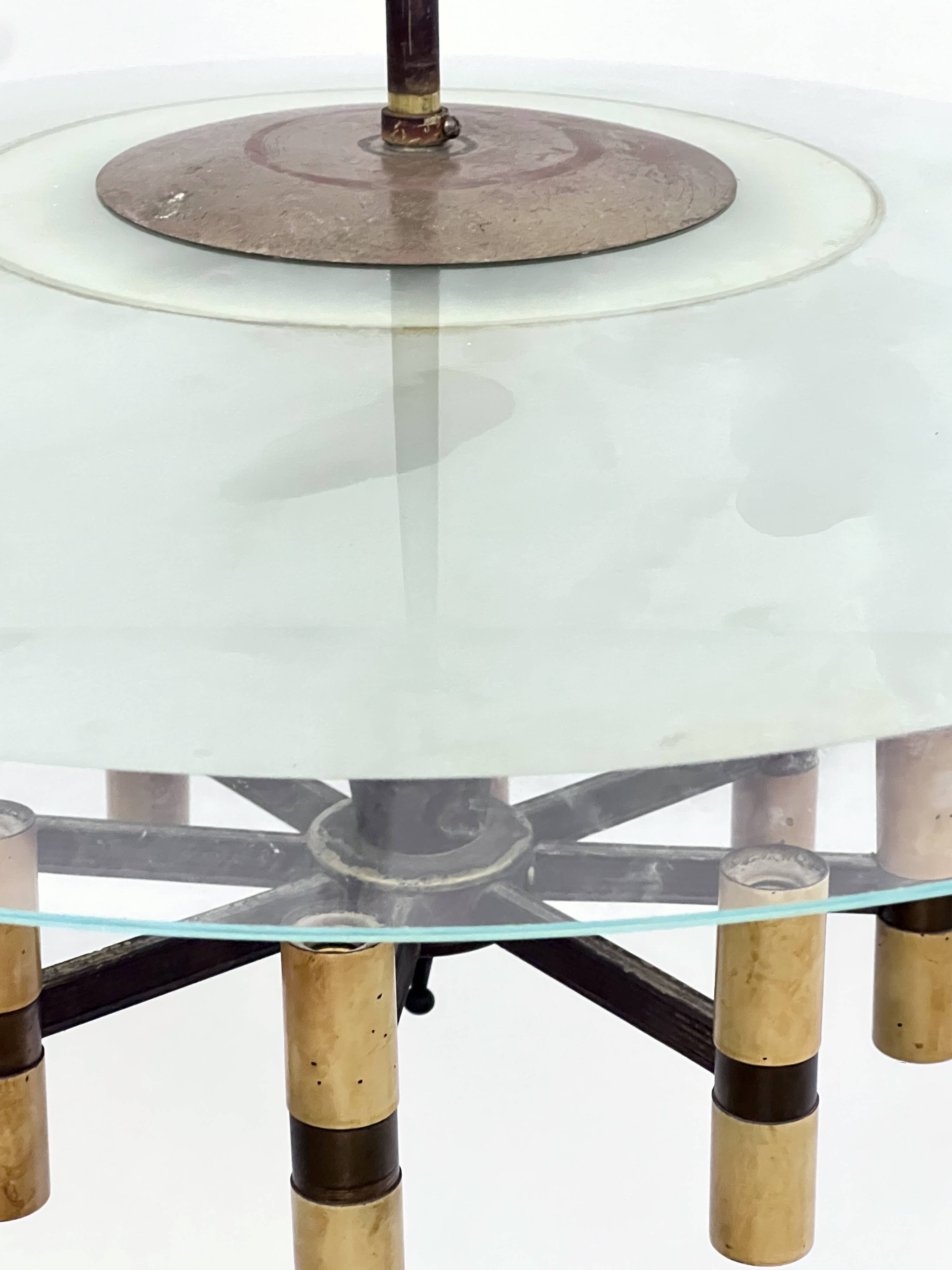 Curved glass disk chandelier. Italy 1950s