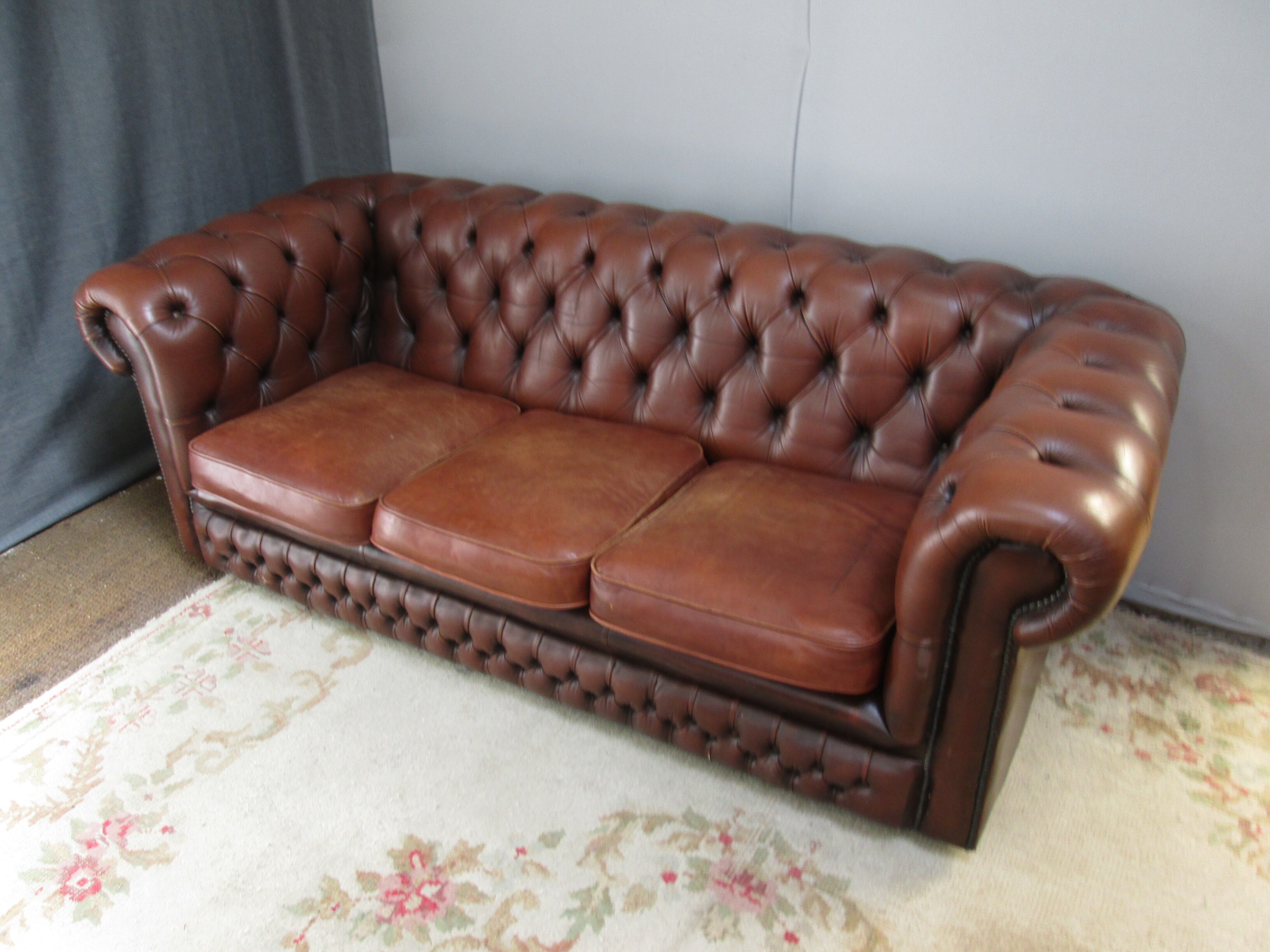 Brown leather chesterfield sofa