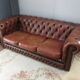 Brown leather chesterfield sofa