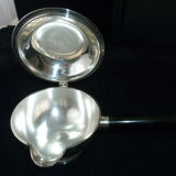 Covered saucepan with silver metal tail