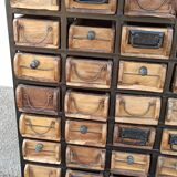 Black metal storage cabinet with 60 wooden drawers