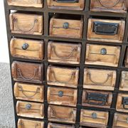 Black metal storage cabinet with 60 wooden drawers