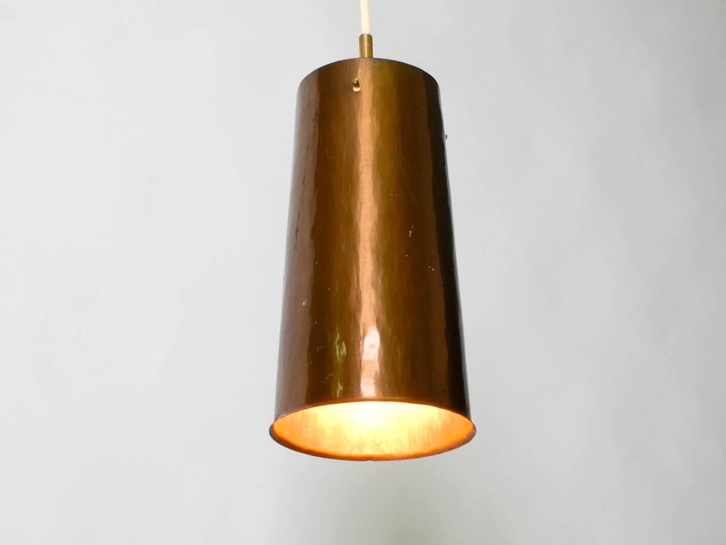 Beautiful Mid Century Modern pendant lamp made of copper shaped like a cone
