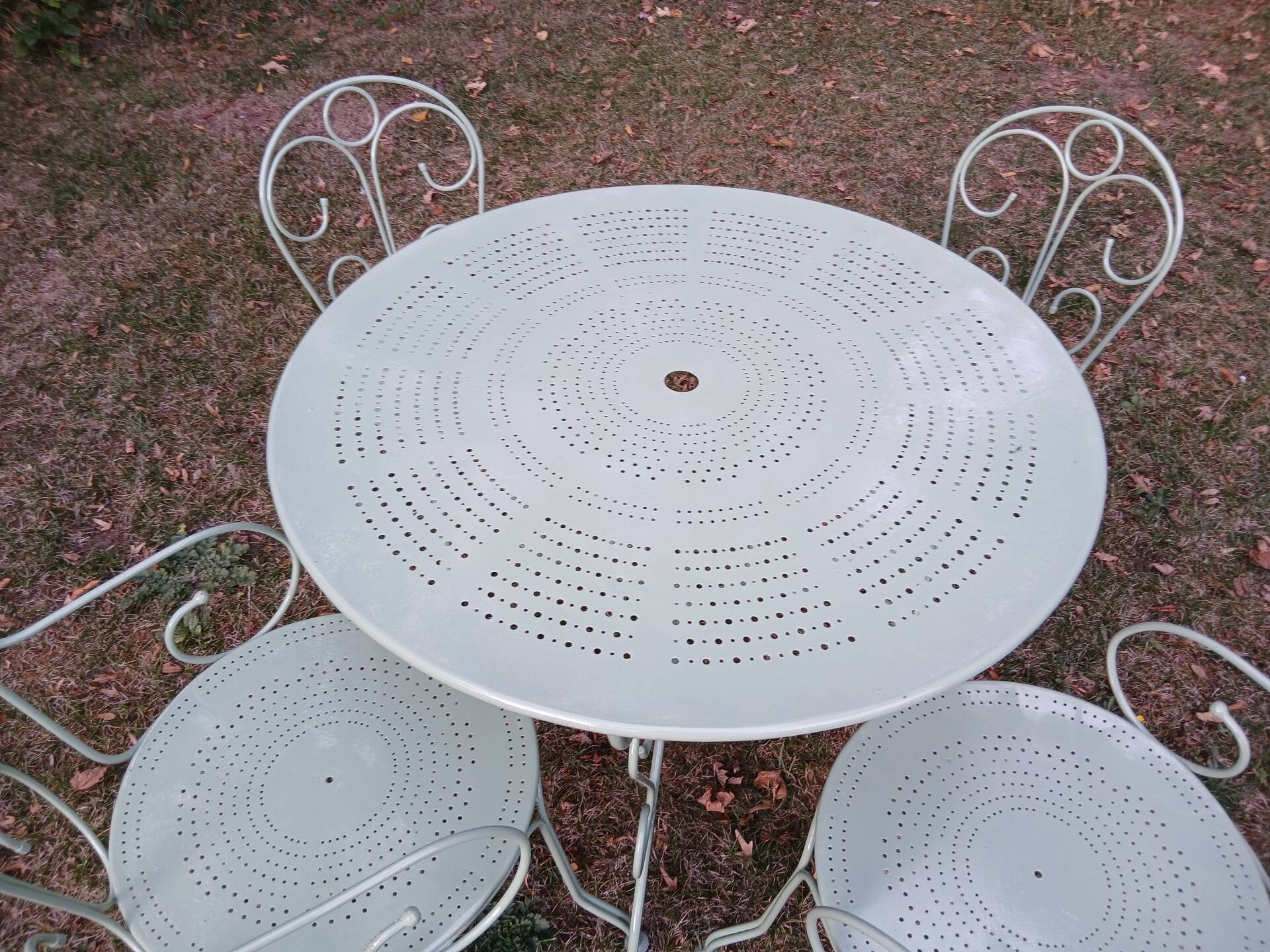 Garden furniture set with 1 table, 2 armchairs, and 2 chairs in antique green wrought iron.