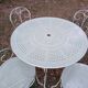 Garden furniture set with 1 table, 2 armchairs, and 2 chairs in antique green wrought iron.