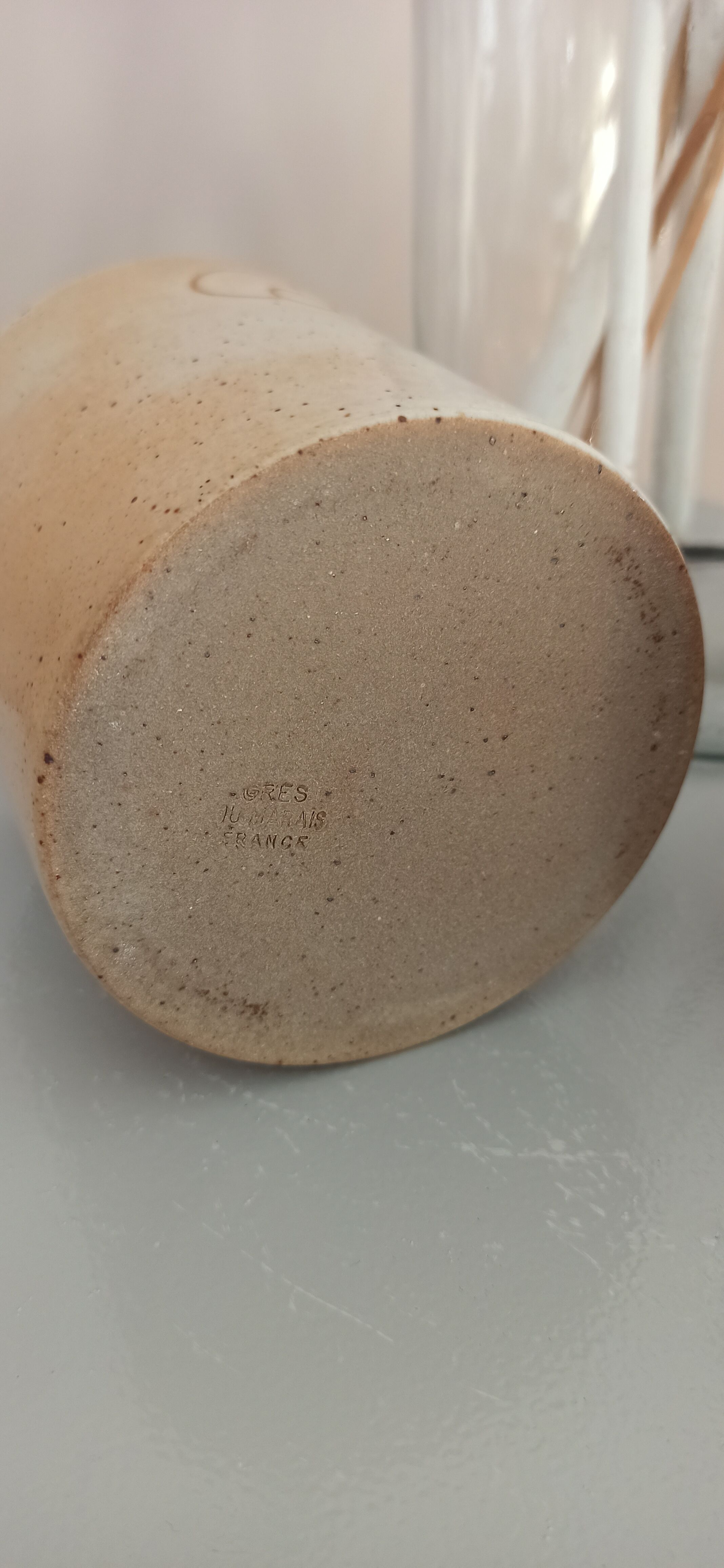 Coffee pot and mug cup in sandstone