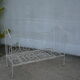 Old white wrought iron child bed