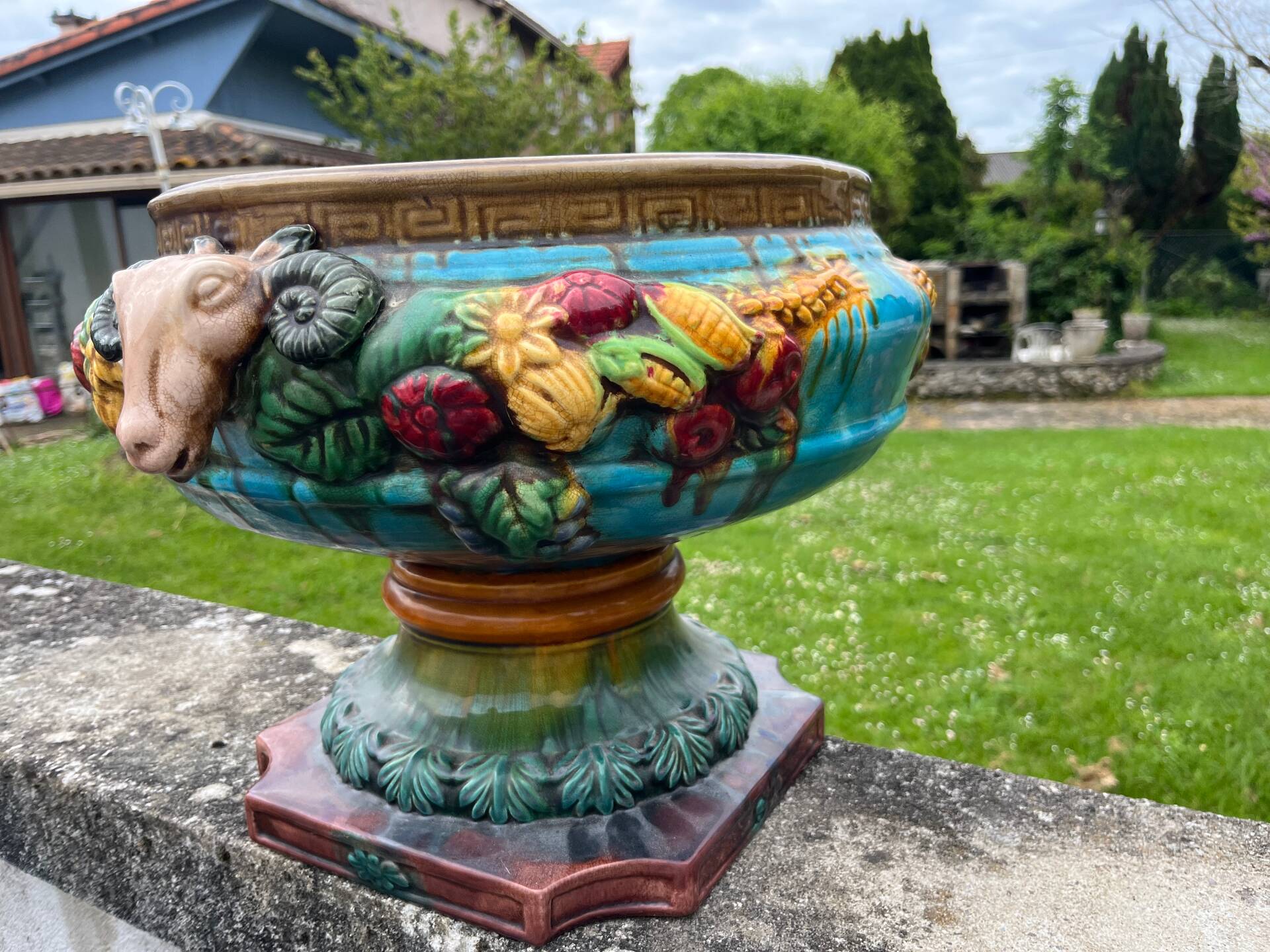 Large neoclassical majolica jardinière with ram's heads.