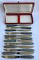 12 Stainless steel blade knives with round tips / Bakelite handles with pearl effect / Prulhière La Béquille + Box / 1950s