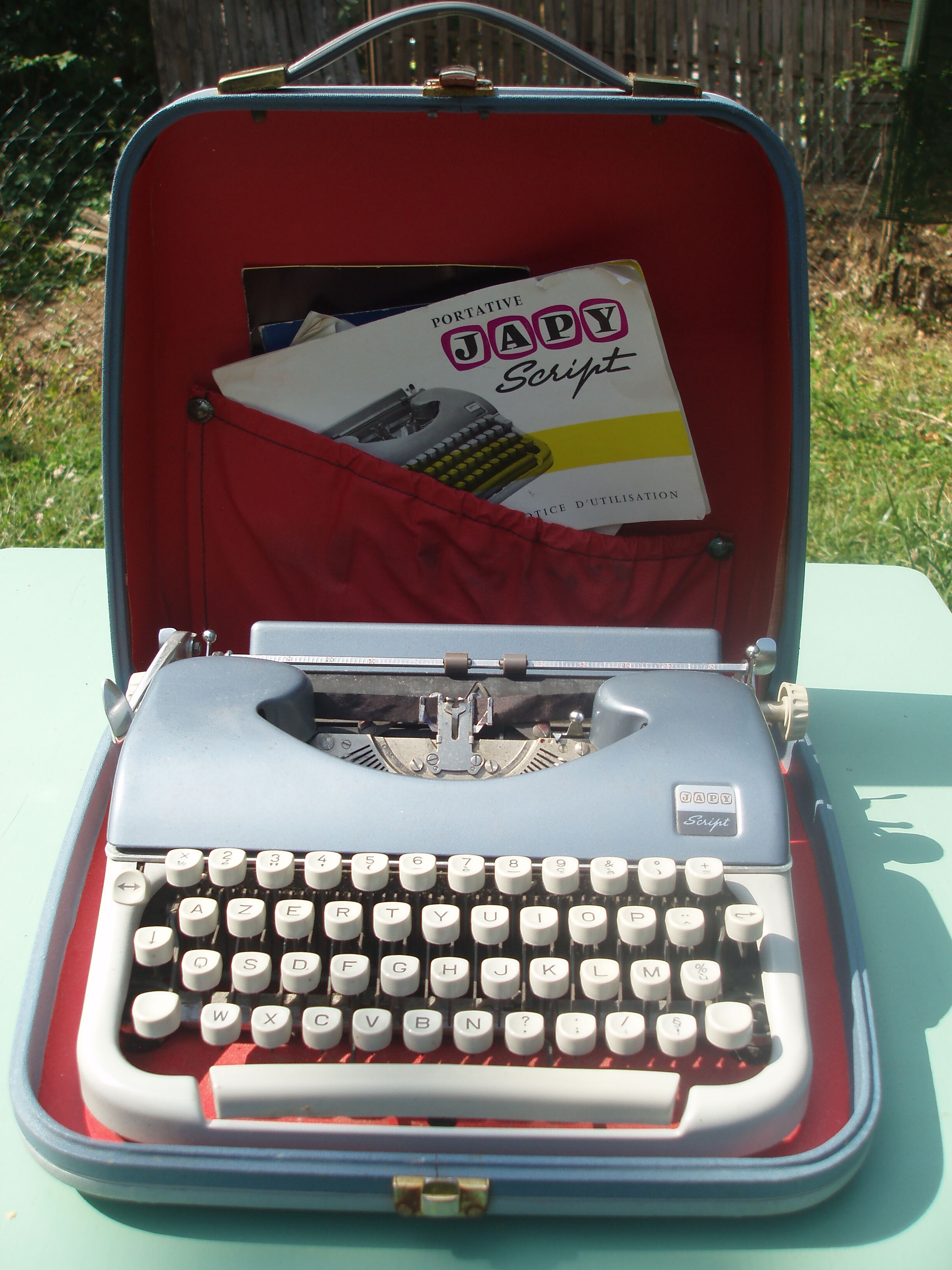 Typewriter blue japy script  with manual and carrying case