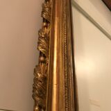 Large antique mirror with flagship shell in wood and gilded stucco