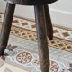 Old dark wood tripod stool