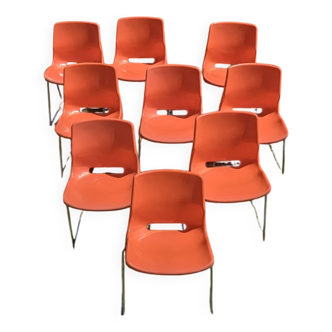 Nine orange Overman chairs from the 70s
