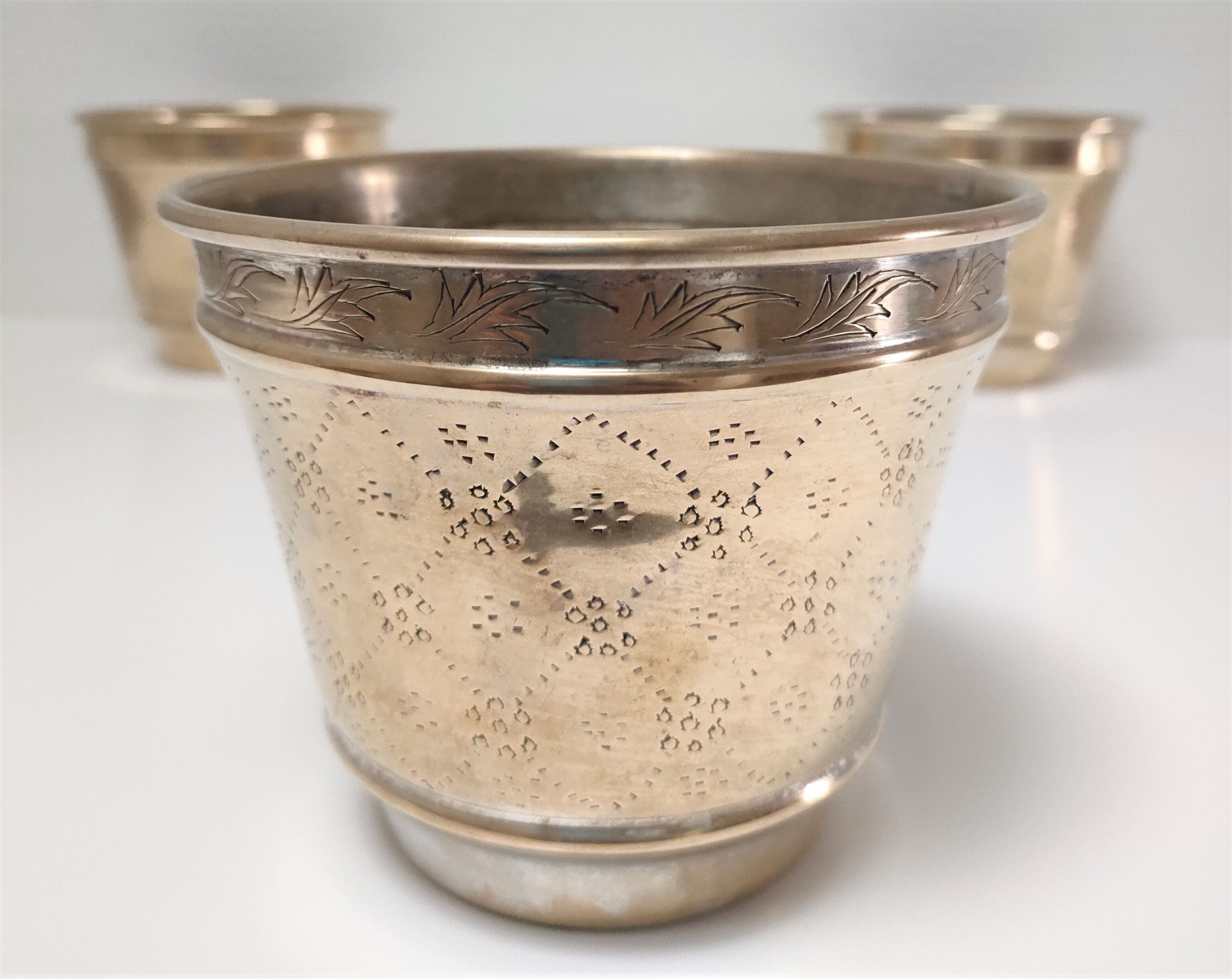 Three pot covers brass silver cover golden patina monogram early twentieth century