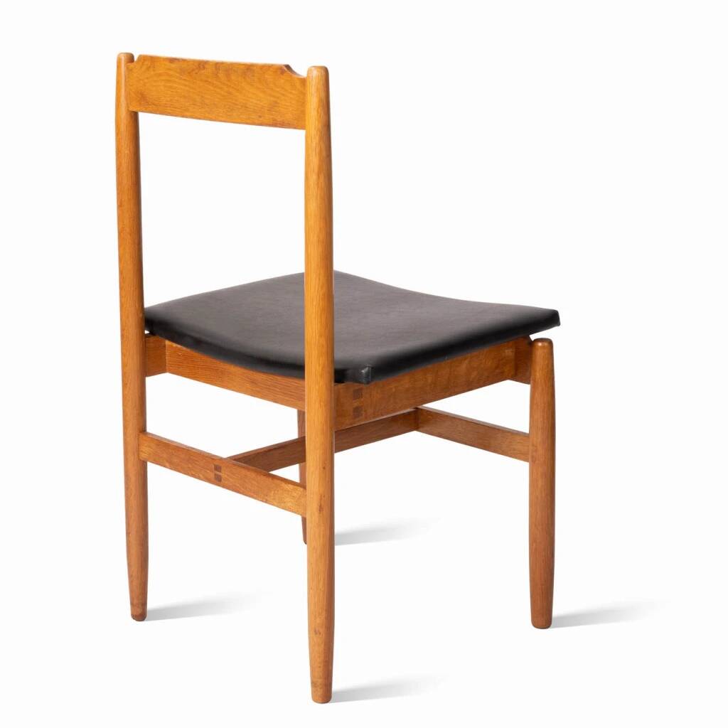 Oak chair with a black leather seat made in the 1960s