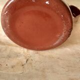 Old pitcher in brown enamelled sheet metal, spout and lid