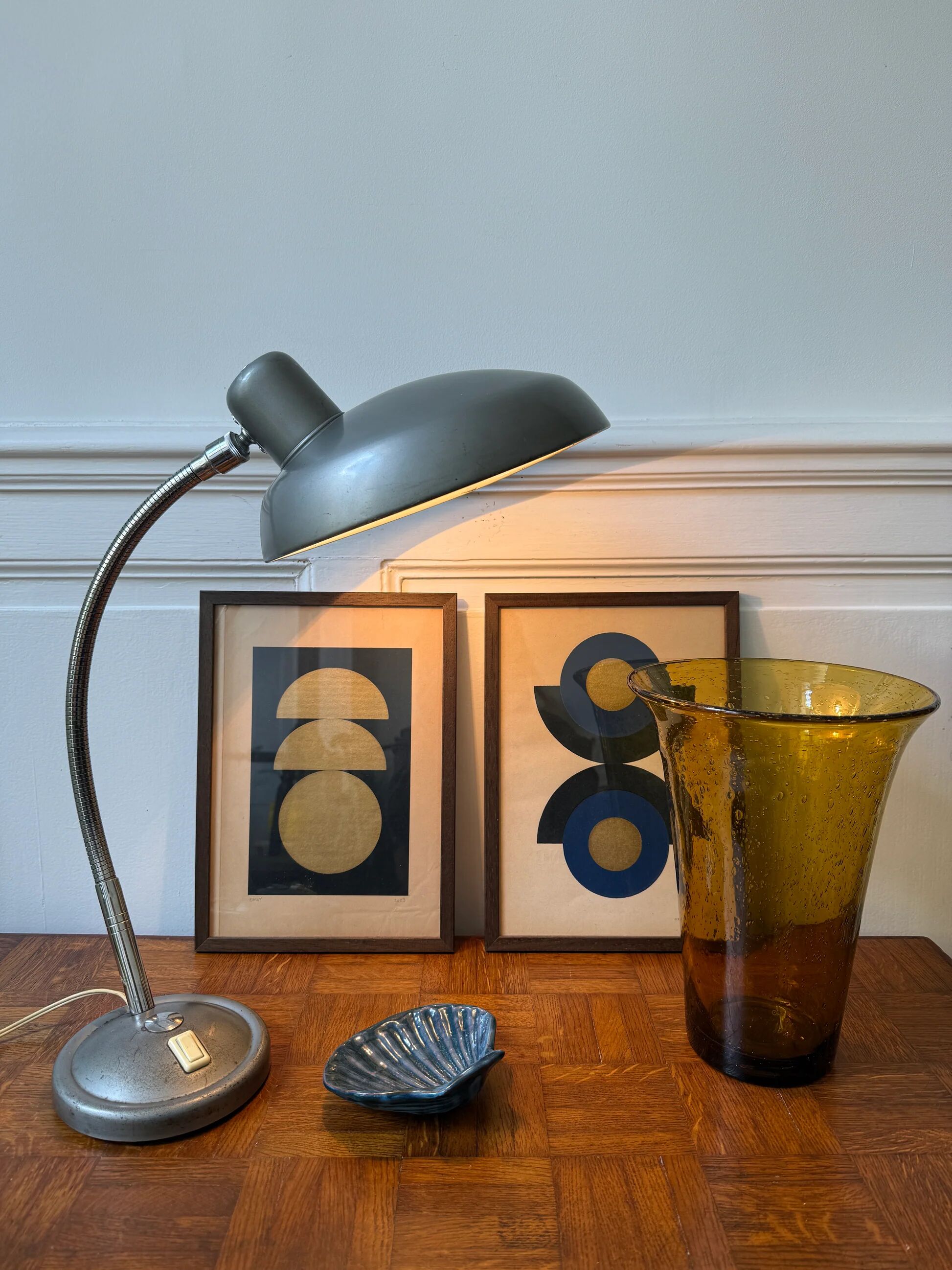 Industrial metal workshop lamp with a gooseneck.