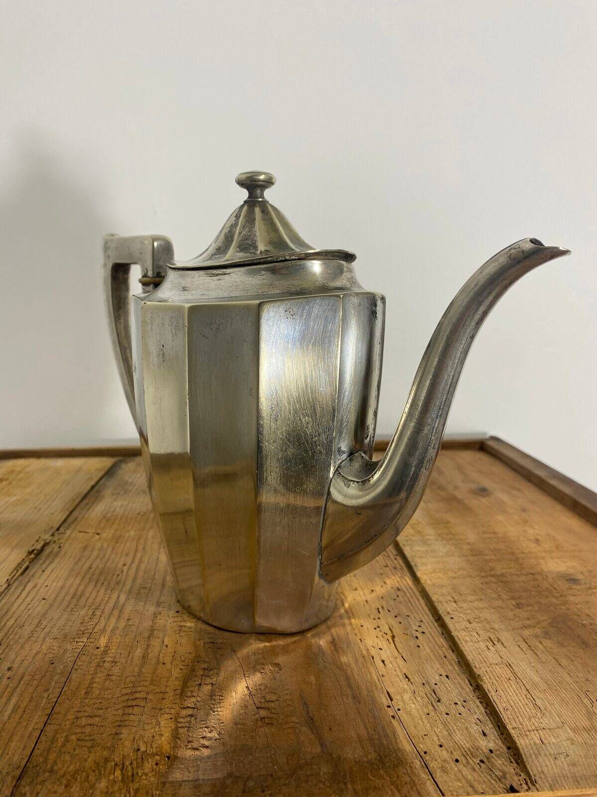 Art Deco silver-plated teapot with faceted decoration.