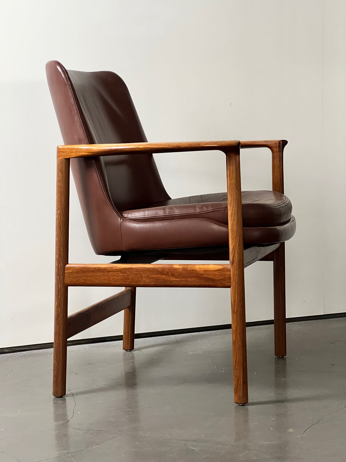 Leather and wood armchair by Ib Kofod Larsen