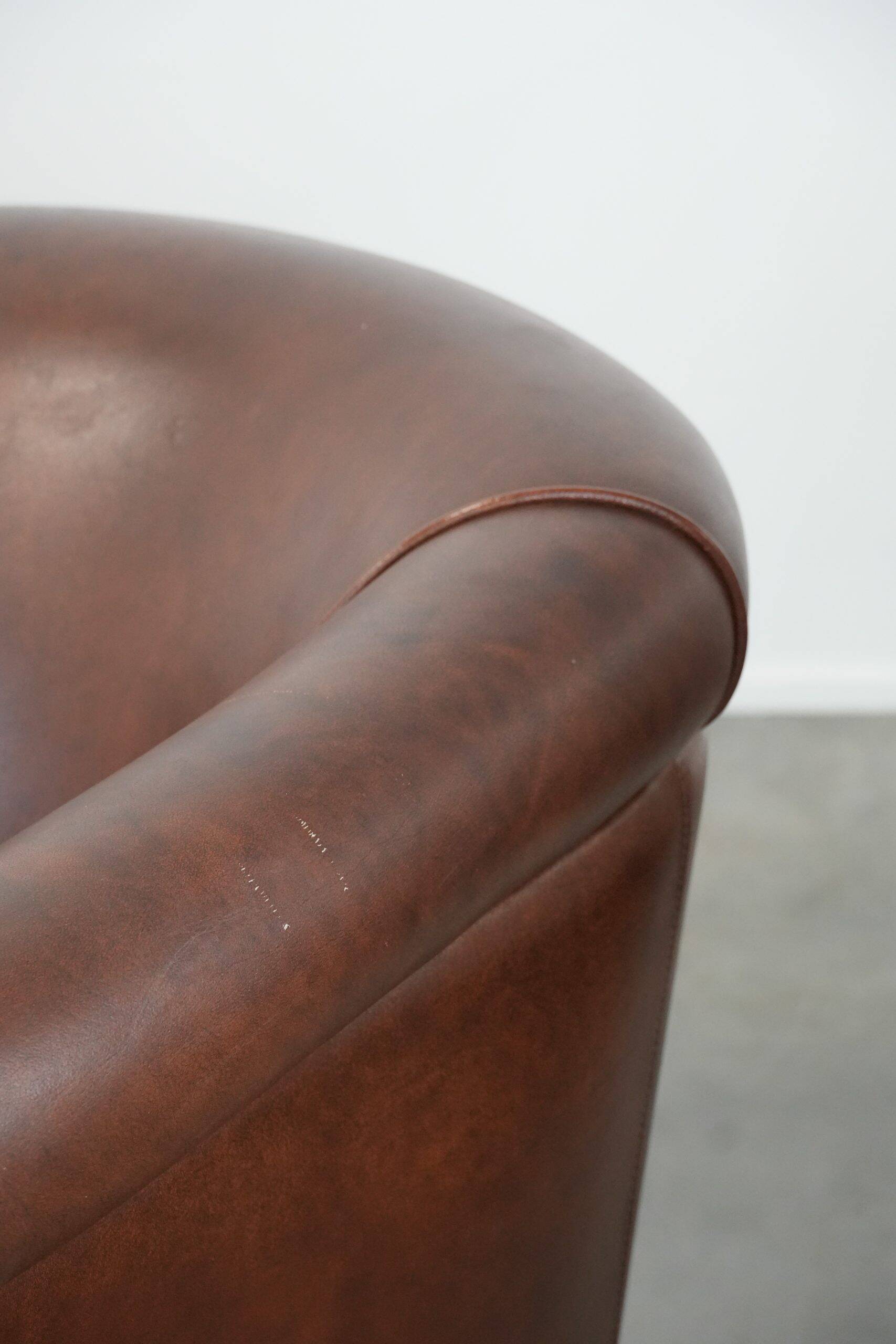 Unique set of two cognac-coloured cow leather club armchairs