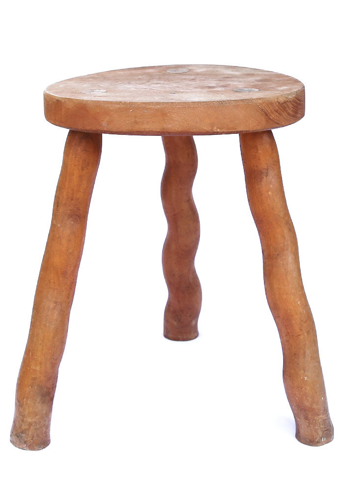 Tripod stool of folk art in light wood and wavy feet