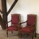 Louis Philippe era armchairs in burgundy-lined ground oak
