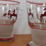 Glasses and carafe decorated with red Christmas reindeer and white granita 60's