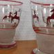 Glasses and carafe decorated with red Christmas reindeer and white granita 60's
