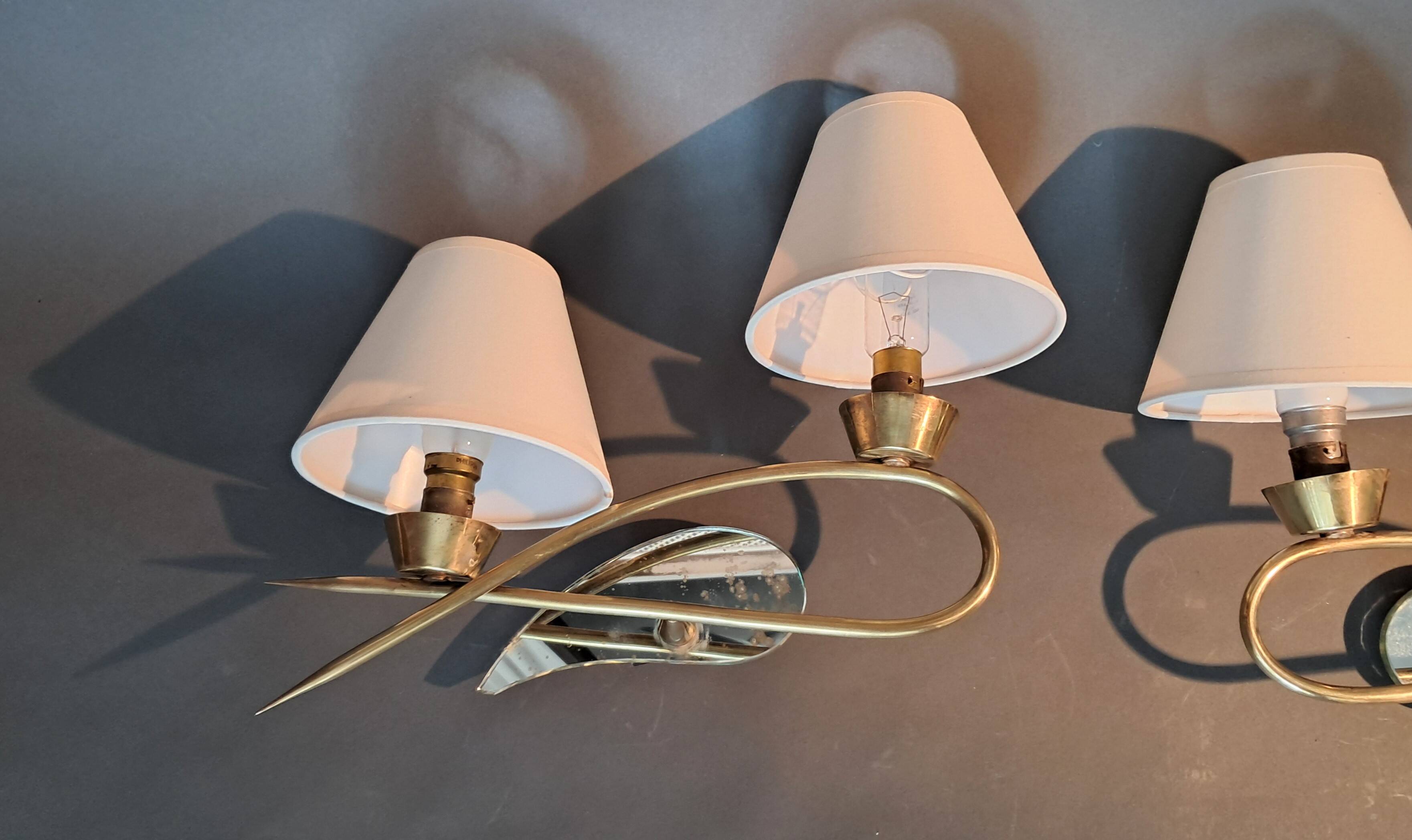 Pair of gilded brass and mirror wall lights, Circa 1960.