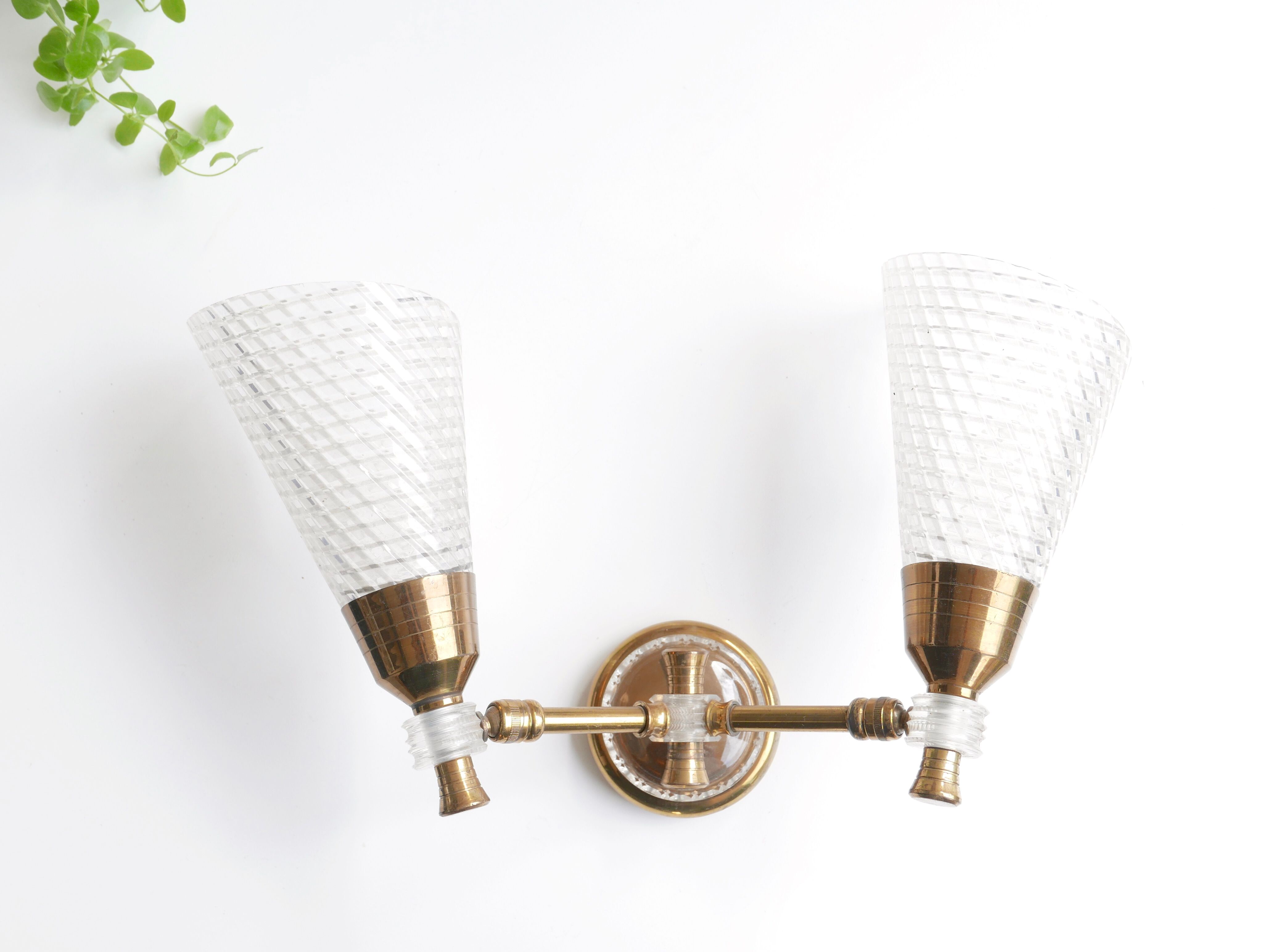 Pair of wall sconces in gold metal and plexiglass, 50 years