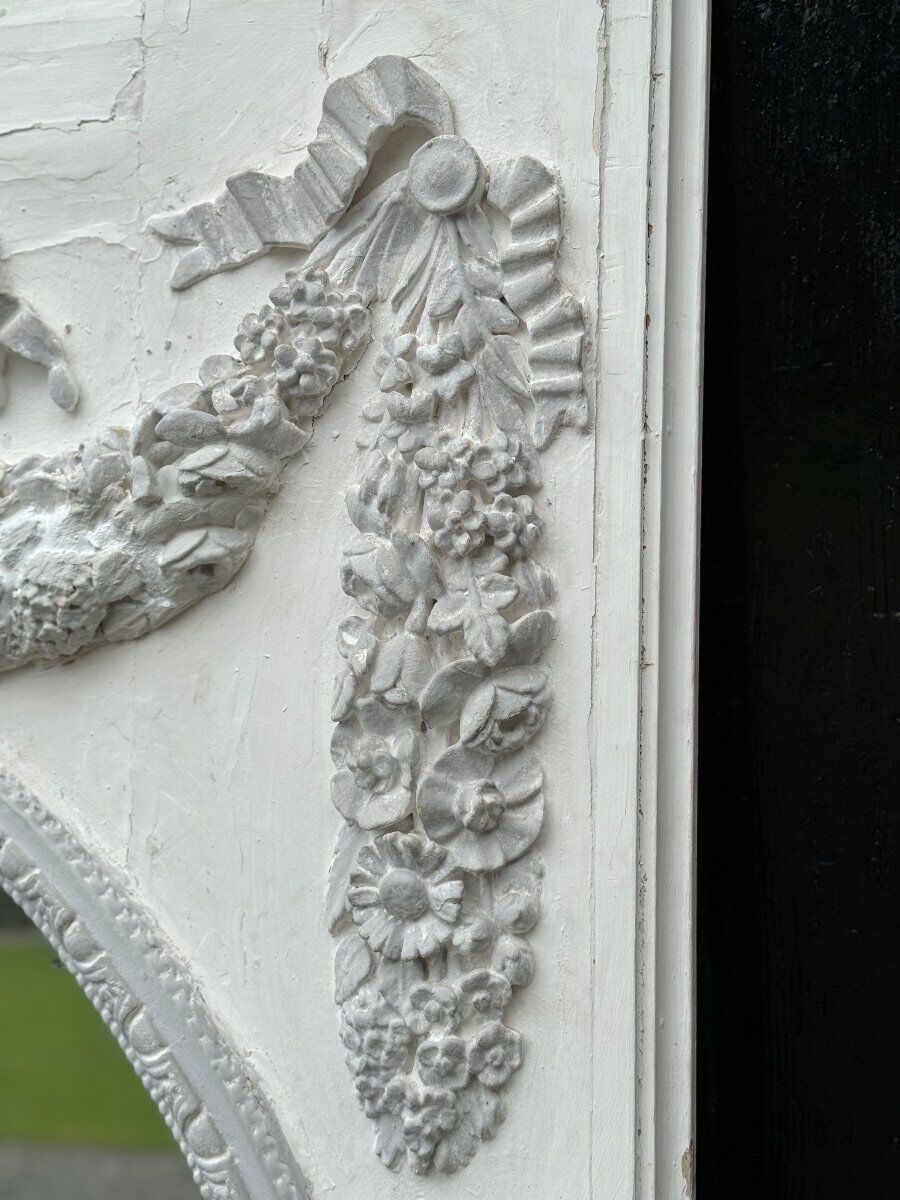 Louis XVI style fireplace mirror, carved wood trumeau with white and grey highlights, 18th century