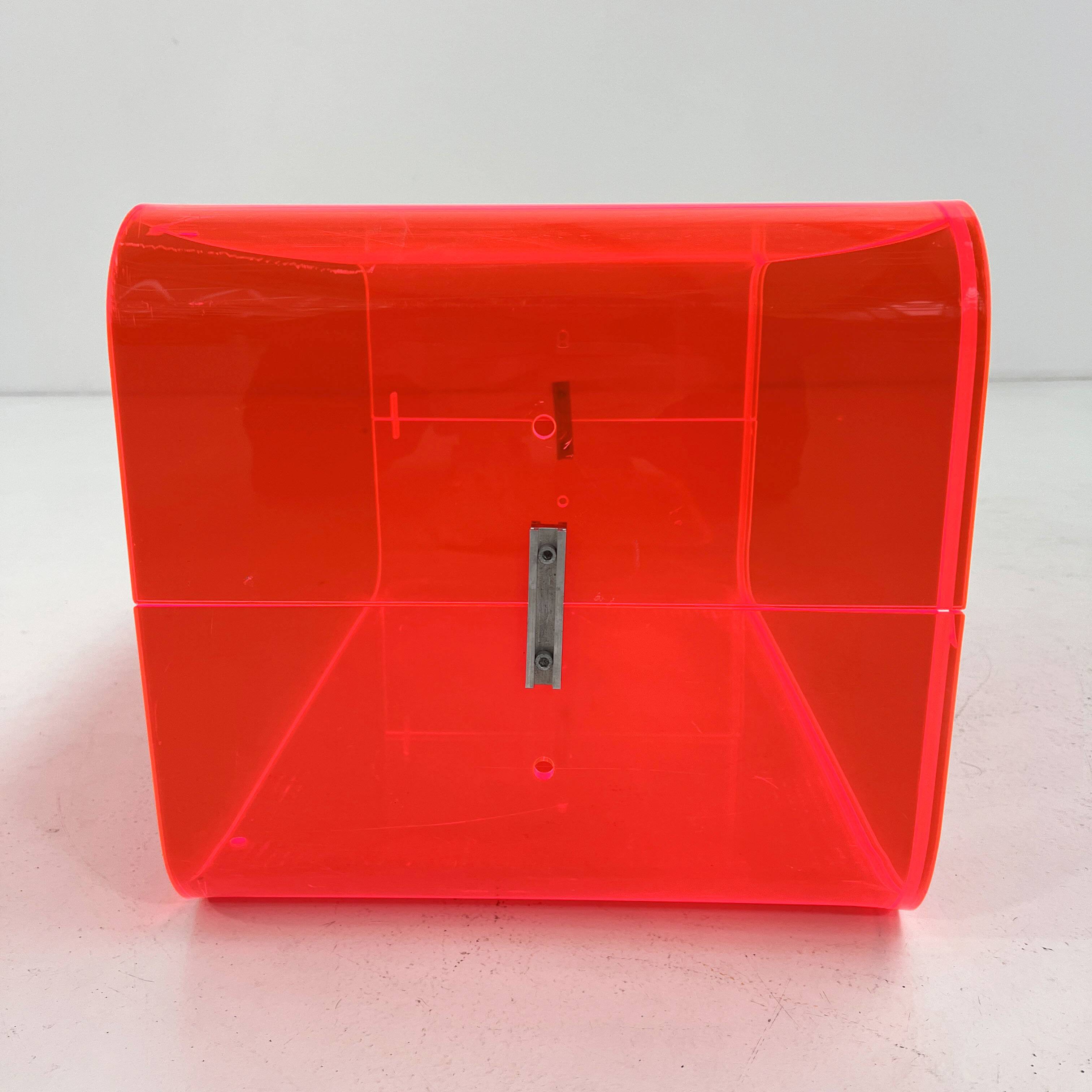 Fluorescent pink plexiglass coffee table, 1980.