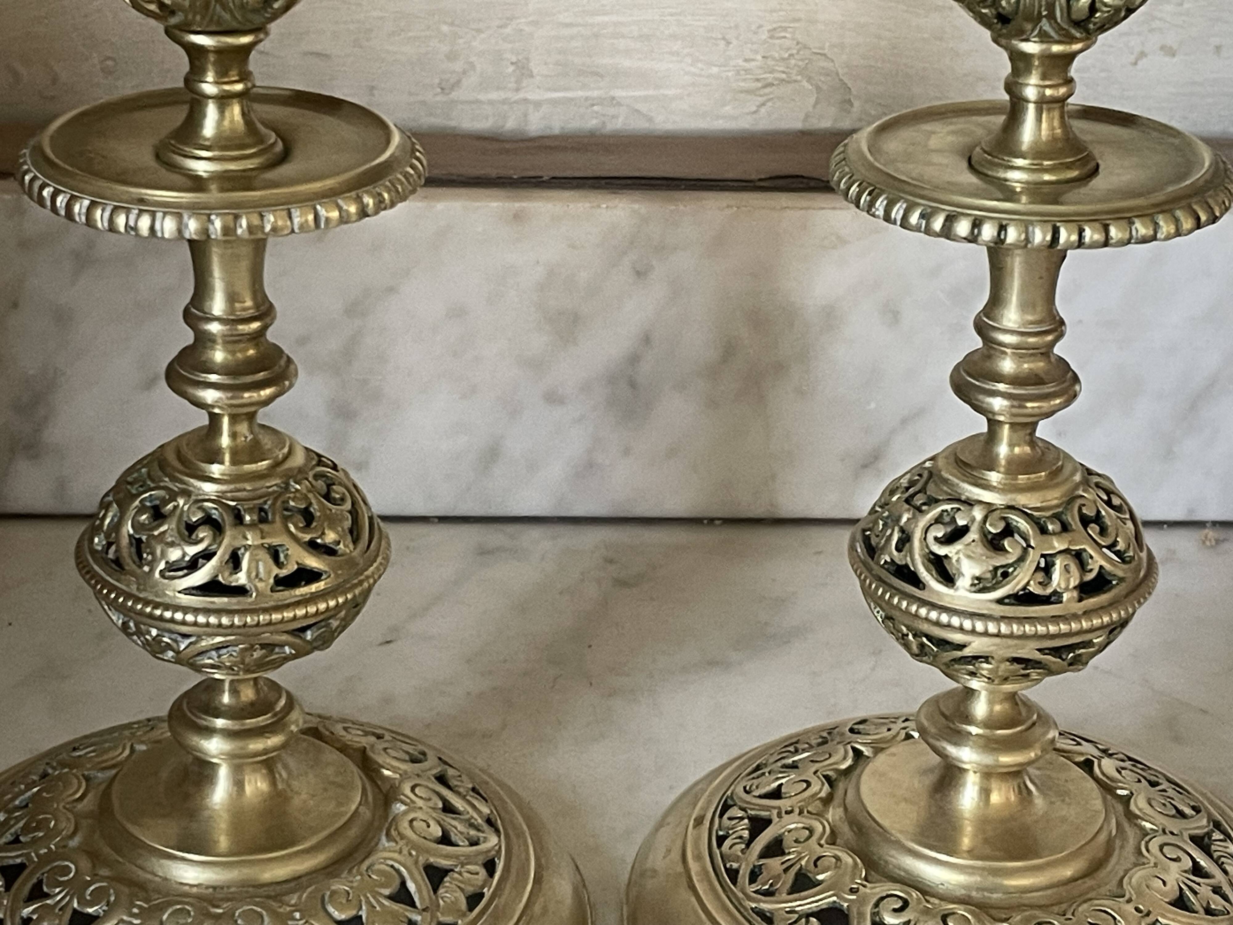 pair of openwork gilded brass candlesticks from the 19th century