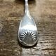 Small silver metal ladle from the Christofle brand, shell model