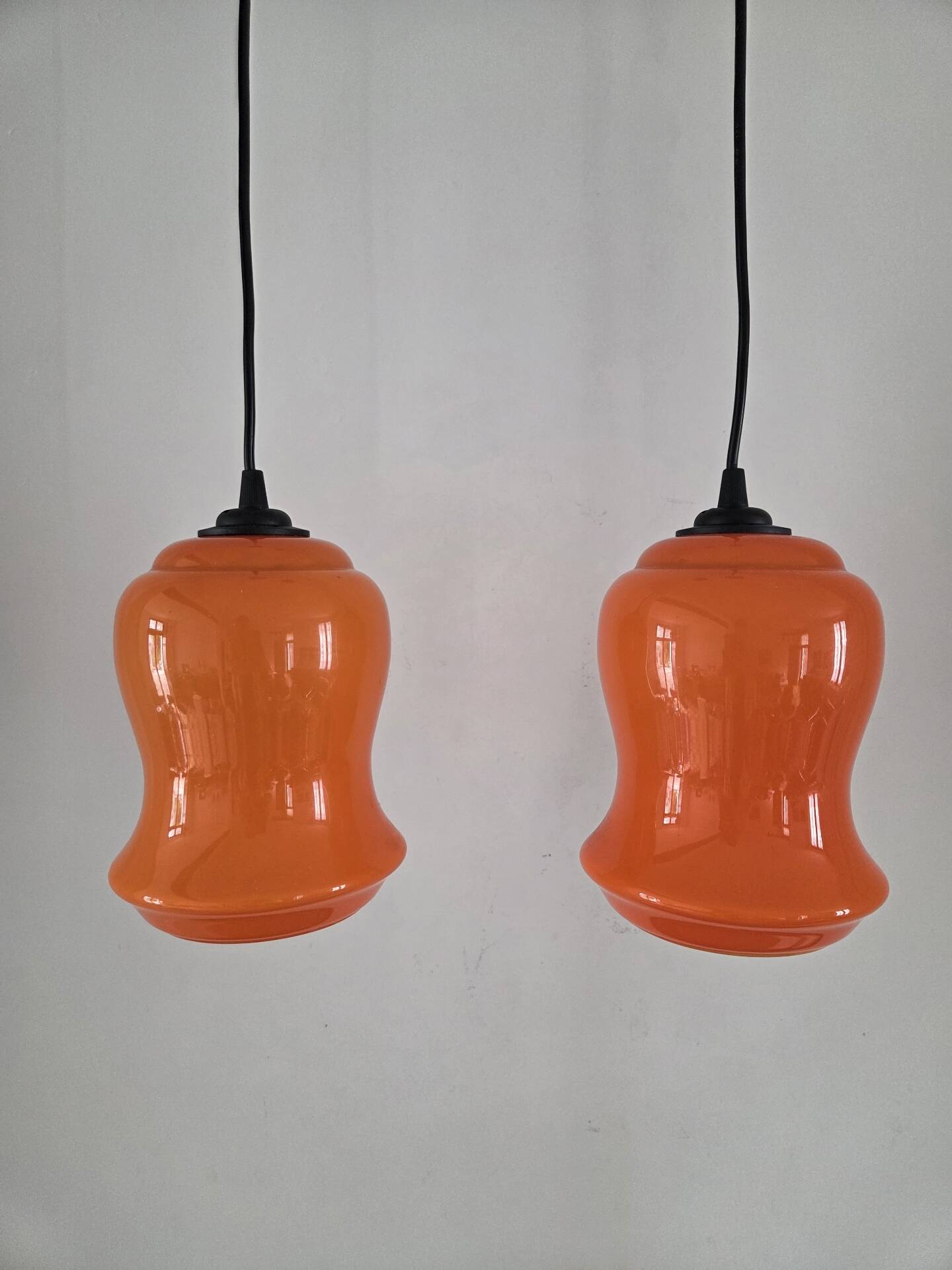 Pair of orange Opaline pendant lights, 1970s