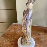 Virgin Mary crowned in metal and brass