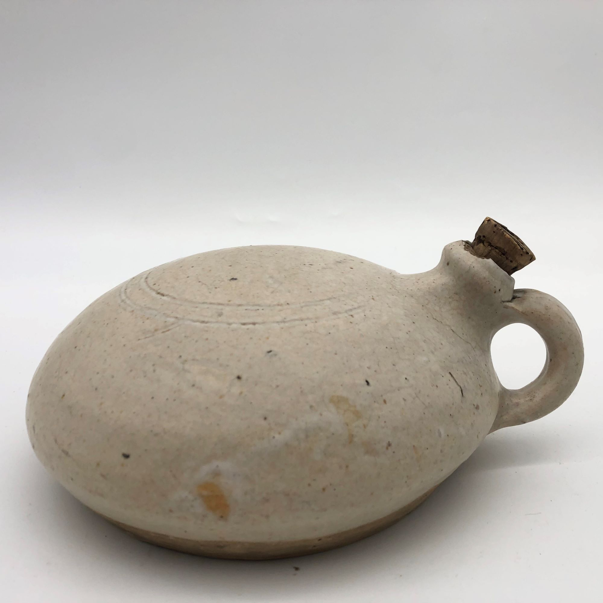 Old round sandstone hot water bottle