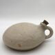 Old round sandstone hot water bottle