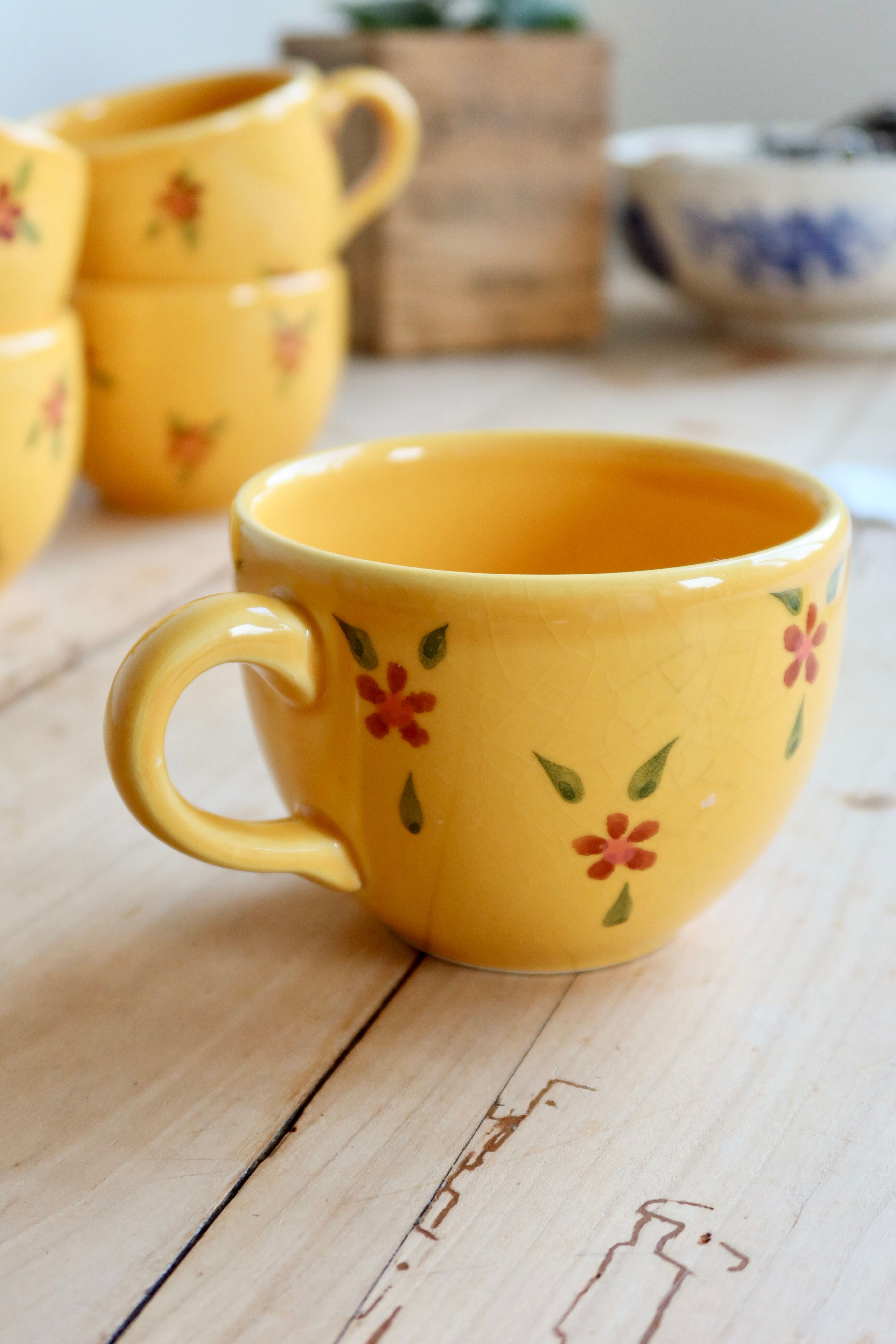 Large vintage ceramic mug in yellow with hand-painted flowers.