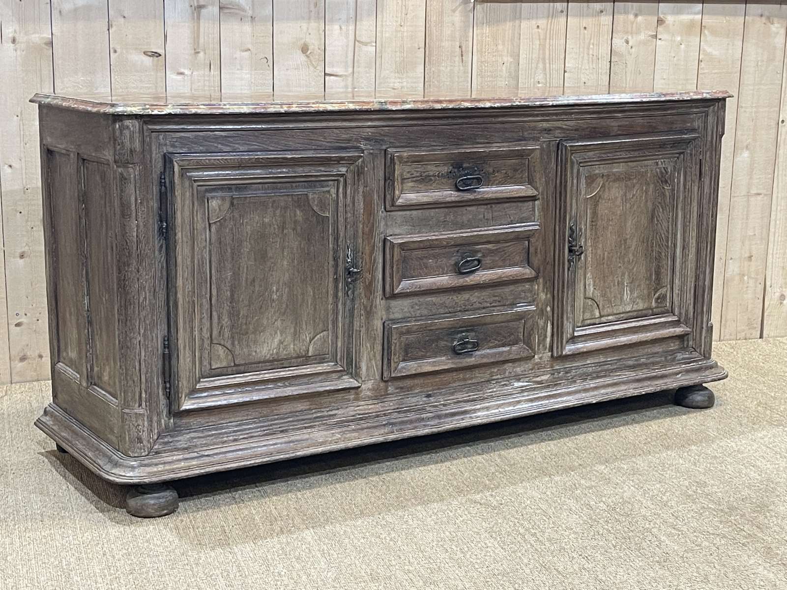 Enfilade of the eighteenth century in oak, top false marble