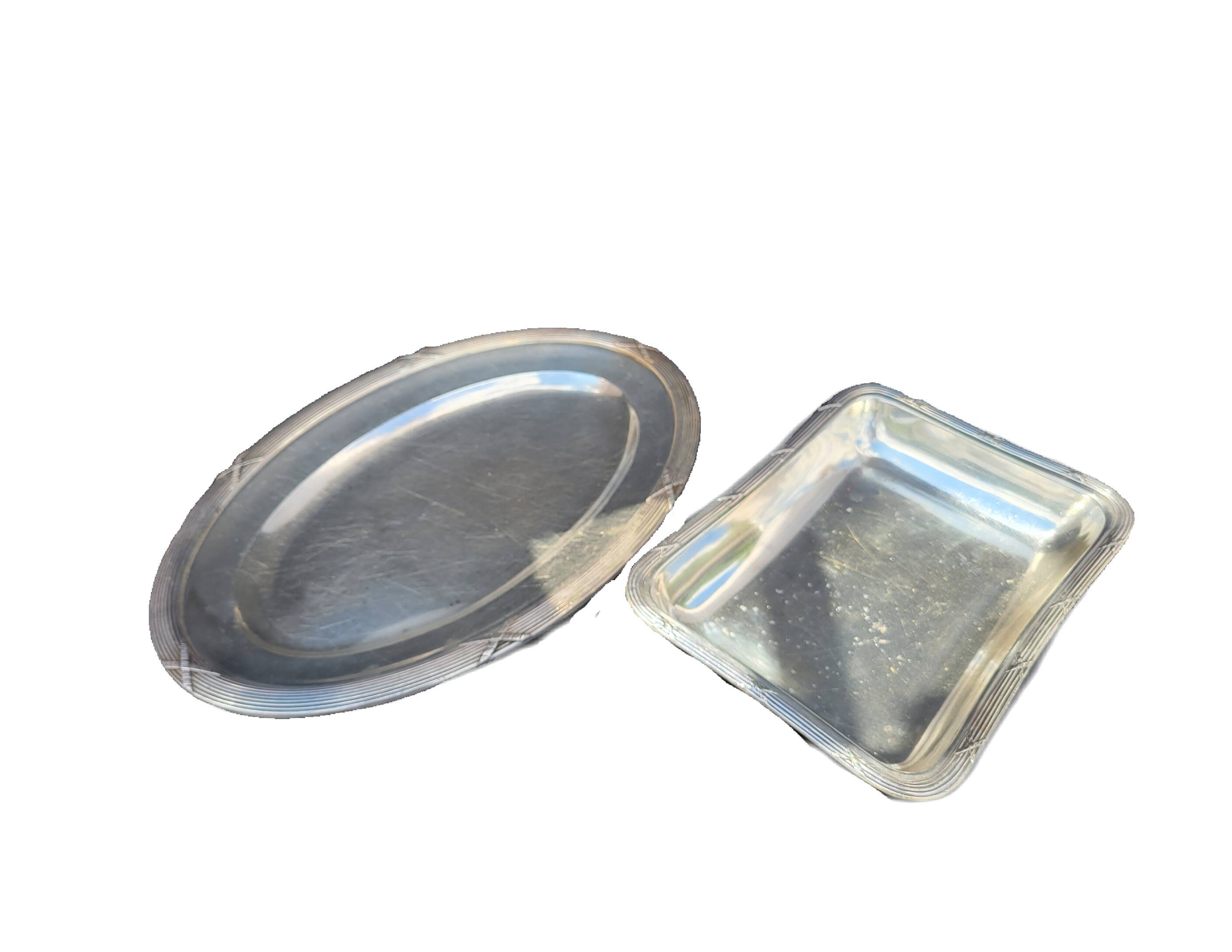 Set of two silver metal trays