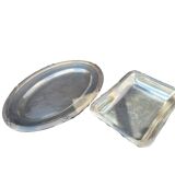 Set of two silver metal trays