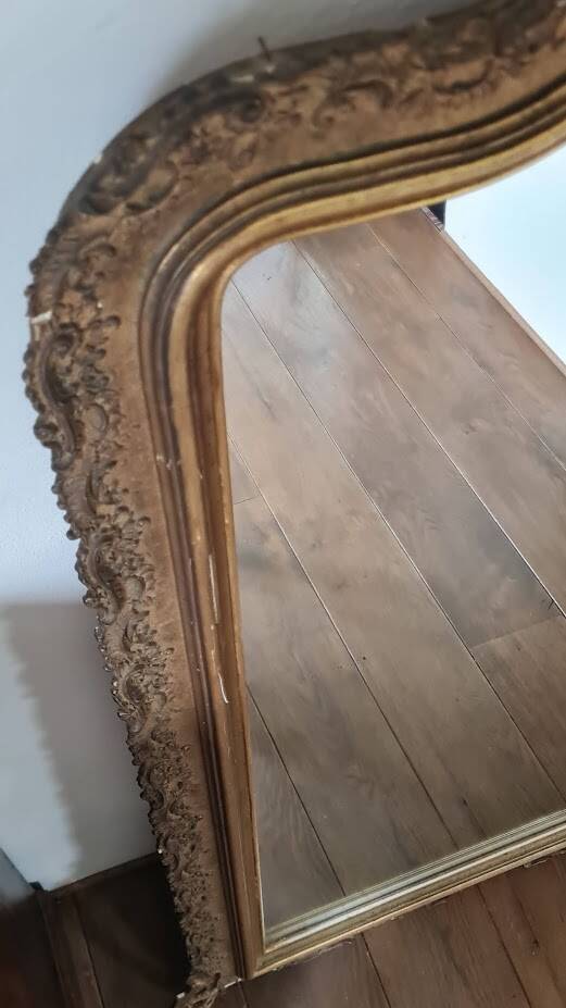 Antique Louis Philippe mirror with a pediment.